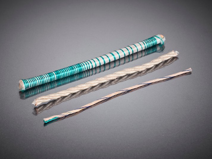 Bifilare Wicklungen aus HF-Litzen in verschiedenen Ausführungen, eingesetzt in industriellen elektronischen Baugruppen zur gezielten Beeinflussung elektrischer Eigenschaften wie Kopplung und Symmetrie.